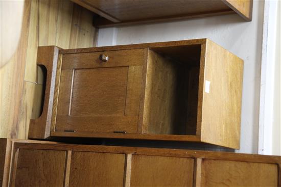 A pair of Gordon Russell oak bedside cupboards W.31cm
